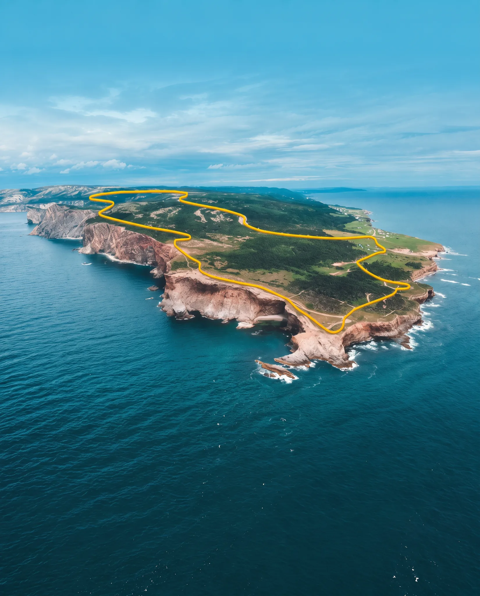 Aerial view of a coastal island surrounded by blue water