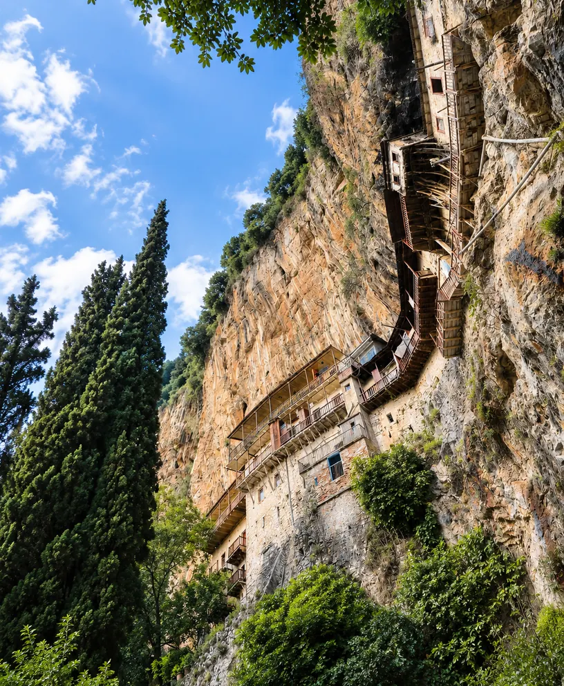 Stone monastery built into the wooded cliffs of Lousios Gorge